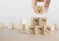 Brainstorming, creative idea or innovative idea concept. Wooden blocks with gear head icon arrangedÃÂ in pyramid stairÃÂ shape and a Royalty Free Stock Photo